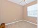 Cozy bedroom with neutral paint, one window for natural light and neutral carpeting at 708 Foggy Morn Ln, Bradenton, FL 34212