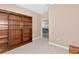 Home office features built-in dark wood bookshelves and an open doorway to another room at 708 Foggy Morn Ln, Bradenton, FL 34212