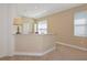 Open living space with carpet and neutral walls, offering a clean and versatile backdrop at 708 Foggy Morn Ln, Bradenton, FL 34212