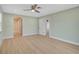 Spacious bedroom with wood-look floors and neutral paint at 7523 S Leewynn Dr, Sarasota, FL 34240