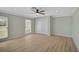 Cozy bedroom with wood floors, ceiling fan, and closet at 7523 S Leewynn Dr, Sarasota, FL 34240