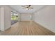 Spacious living room with wood floors and sliding glass doors, perfect for entertaining at 7523 S Leewynn Dr, Sarasota, FL 34240