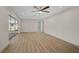 Bright living room with wood floors and sliding glass doors to outdoor space at 7523 S Leewynn Dr, Sarasota, FL 34240