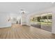 Bright living room featuring wood floors, recessed lighting, and sliding glass doors to outdoor space at 7523 S Leewynn Dr, Sarasota, FL 34240