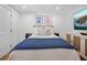 Bright bedroom features beach-themed decor, wood accents, and warm recessed lighting at 7701 Palm Dr, Holmes Beach, FL 34217