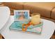 Charming side table decor with coastal accents and a beach-themed picture frame at 7701 Palm Dr, Holmes Beach, FL 34217