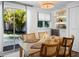 Bright dining area with backyard views, perfect for Gathering meals and entertaining guests at 7701 Palm Dr, Holmes Beach, FL 34217