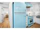 Stylish kitchen with vintage appliances, modern cabinetry, and stainless steel sink at 7701 Palm Dr, Holmes Beach, FL 34217