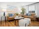Cozy living room featuring comfortable sofas, natural light, and stylish decor. Great place to relax at 7701 Palm Dr, Holmes Beach, FL 34217