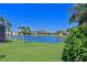 Enjoy scenic views of the lake from this property's lush green backyard, perfect for relaxation and recreation at 8211 Summer Greens Ter, Bradenton, FL 34212