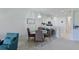 Cozy dining area featuring a chandelier with seating for four at the table at 8211 Summer Greens Ter, Bradenton, FL 34212