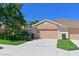 Well-maintained home features a two-car garage, tile roof, manicured landscaping, and a welcoming entrance at 8211 Summer Greens Ter, Bradenton, FL 34212