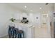 Modern kitchen with breakfast bar, counter seating, and a view to the hallway and other rooms at 8211 Summer Greens Ter, Bradenton, FL 34212