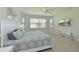 Comfortable main bedroom with large bed, TV, and a serene atmosphere at 8211 Summer Greens Ter, Bradenton, FL 34212