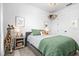 Cozy bedroom with a comfortable bed, playful decor, and ample natural light at 8227 Nevis Run, Bradenton, FL 34202