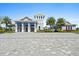 Community clubhouse with palm trees, offering residents a place for recreation and socializing at 8227 Nevis Run, Bradenton, FL 34202