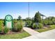 Community dog park featuring a fenced area, shade, and well-maintained landscaping at 8227 Nevis Run, Bradenton, FL 34202