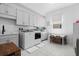 Large laundry room with modern appliances, ample storage, and a convenient folding area at 8227 Nevis Run, Bradenton, FL 34202