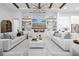 Spacious living room with fireplace, marble accents, built-in shelving, and two comfortable sofas at 8227 Nevis Run, Bradenton, FL 34202
