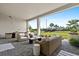 Expansive outdoor patio with cozy seating area overlooking a lush green lawn at 8227 Nevis Run, Bradenton, FL 34202