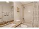 Well-lit bathroom featuring a granite-topped vanity, a shower-tub combination, and modern fixtures at 9411 Forest Hills Cir, Sarasota, FL 34238
