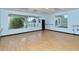 Yoga studio featuring wood floors and plenty of natural light at 9411 Forest Hills Cir, Sarasota, FL 34238