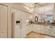 Open kitchen featuring white appliances, granite countertops and tiled floors at 9411 Forest Hills Cir, Sarasota, FL 34238