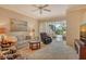 Bright and airy living room with neutral tones, comfortable seating and access to the outdoor patio at 9411 Forest Hills Cir, Sarasota, FL 34238