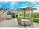 Relaxing screened patio with outdoor dining set, perfect for enjoying the beautiful weather at 9411 Forest Hills Cir, Sarasota, FL 34238