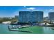Stunning aerial view of waterfront condo with boat docks and tropical landscaping at 988 Blvd Of The Arts # 1209, Sarasota, FL 34236