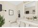 Bright bathroom offers a sink with modern fixtures, an updated toilet and stylish decor, offering a refreshing space at 988 Blvd Of The Arts # 1209, Sarasota, FL 34236
