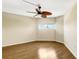 This empty bedroom has wood flooring, and a small window for natural light, awaiting your personal touch at 988 Blvd Of The Arts # 1209, Sarasota, FL 34236