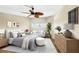 This staged bedroom features a serene color palette, plush bedding, and modern decor for comfortable living at 988 Blvd Of The Arts # 1209, Sarasota, FL 34236