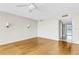 A bedroom featuring hardwood floors, sconce lighting, and an ensuite bathroom at 988 Blvd Of The Arts # 1209, Sarasota, FL 34236
