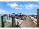 Scenic community dock featuring boat slips, kayak storage, and access to recreational boating and water activities at 988 Blvd Of The Arts # 1209, Sarasota, FL 34236