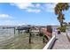 Beautiful waterfront dock featuring boat slips, kayak storage, and access to open water and waterfront activities at 988 Blvd Of The Arts # 1209, Sarasota, FL 34236