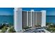 Beautiful condo exterior view with parking, landscaping, and waterfront access at 988 Blvd Of The Arts # 1209, Sarasota, FL 34236