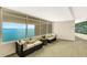 Inviting hallway sitting area offers stunning waterfront views and comfortable seating to enjoy the scenery at 988 Blvd Of The Arts # 1209, Sarasota, FL 34236