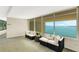 Inviting hallway sitting area offers stunning waterfront views and comfortable seating to enjoy the scenery at 988 Blvd Of The Arts # 1209, Sarasota, FL 34236