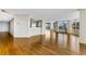 Bright living room featuring wood floors, and expansive windows with views of the city at 988 Blvd Of The Arts # 1209, Sarasota, FL 34236