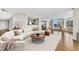 Bright and airy living room with hardwood floors, city views, and an open layout, perfect for modern living at 988 Blvd Of The Arts # 1209, Sarasota, FL 34236