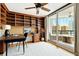 Bright office with built-in shelves and desk area, plus balcony with seating at 988 Blvd Of The Arts # 1209, Sarasota, FL 34236