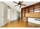 Home office featuring built-in desk and shelving, with a view into the hallway at 988 Blvd Of The Arts # 1209, Sarasota, FL 34236
