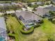 Aerial view of a home with a screened-in pool and beautifully landscaped backyard at 11019 Water Lily Way, Lakewood Ranch, FL 34202