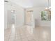 Inviting foyer with tile floors, chandelier, and sidelight windows, creating a bright and welcoming entrance at 11019 Water Lily Way, Lakewood Ranch, FL 34202