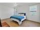 Bright bedroom featuring tile flooring, ceiling fan, and windows with natural light at 115 64Th E Ave, Bradenton, FL 34203