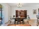 Dining area with dining table, china cabinet, and natural light at 115 64Th E Ave, Bradenton, FL 34203