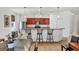 Kitchen featuring breakfast bar, stainless steel refrigerator, and pendant lighting at 115 64Th E Ave, Bradenton, FL 34203