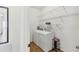 Convenient laundry room featuring a modern washer and dryer and wire shelving at 115 64Th E Ave, Bradenton, FL 34203