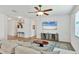 Open-concept living room featuring neutral paint, ceiling fan, and tile flooring at 115 64Th E Ave, Bradenton, FL 34203